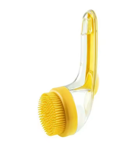 2-in-1 pet bath brush and massage tool with soft silicone bristles and a soap dispenser for dogs and cats.