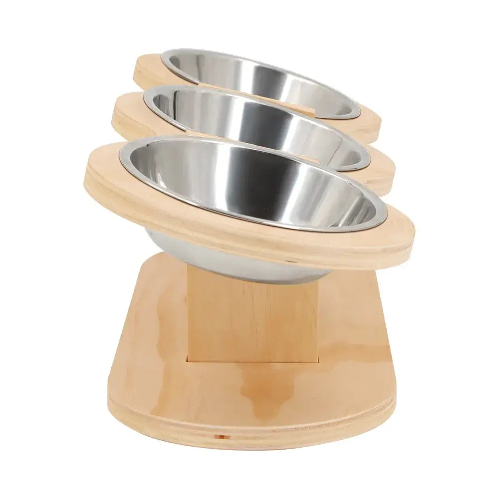 Tilted 3-in-1 cat feeder with three stainless steel bowls on a wooden stand for comfortable feeding.