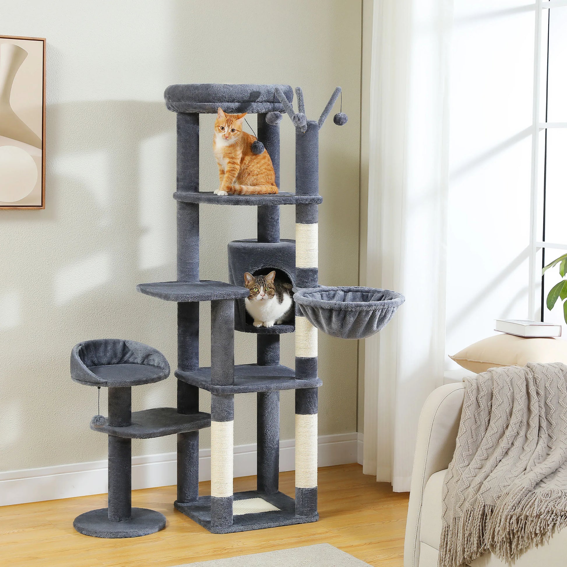 Cat tree with multiple levels and a cat sitting on one of the platforms in a living room.