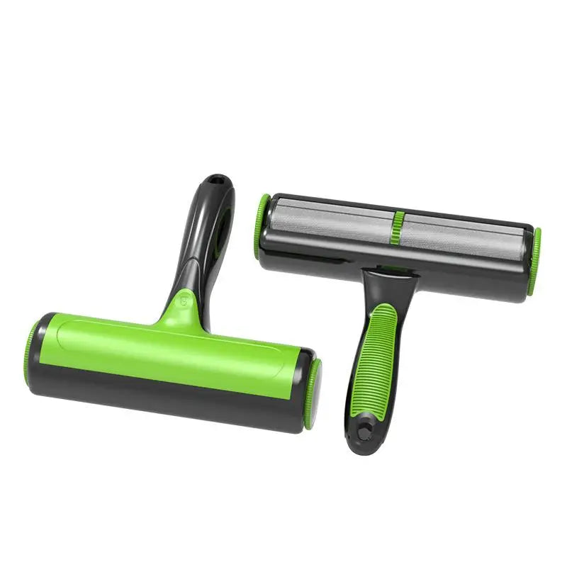 Two green and black pet grooming tools on a white background
