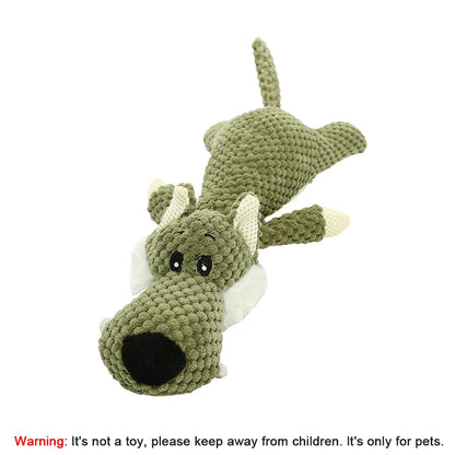 Crocheted dragon toy on a white background with a warning label.