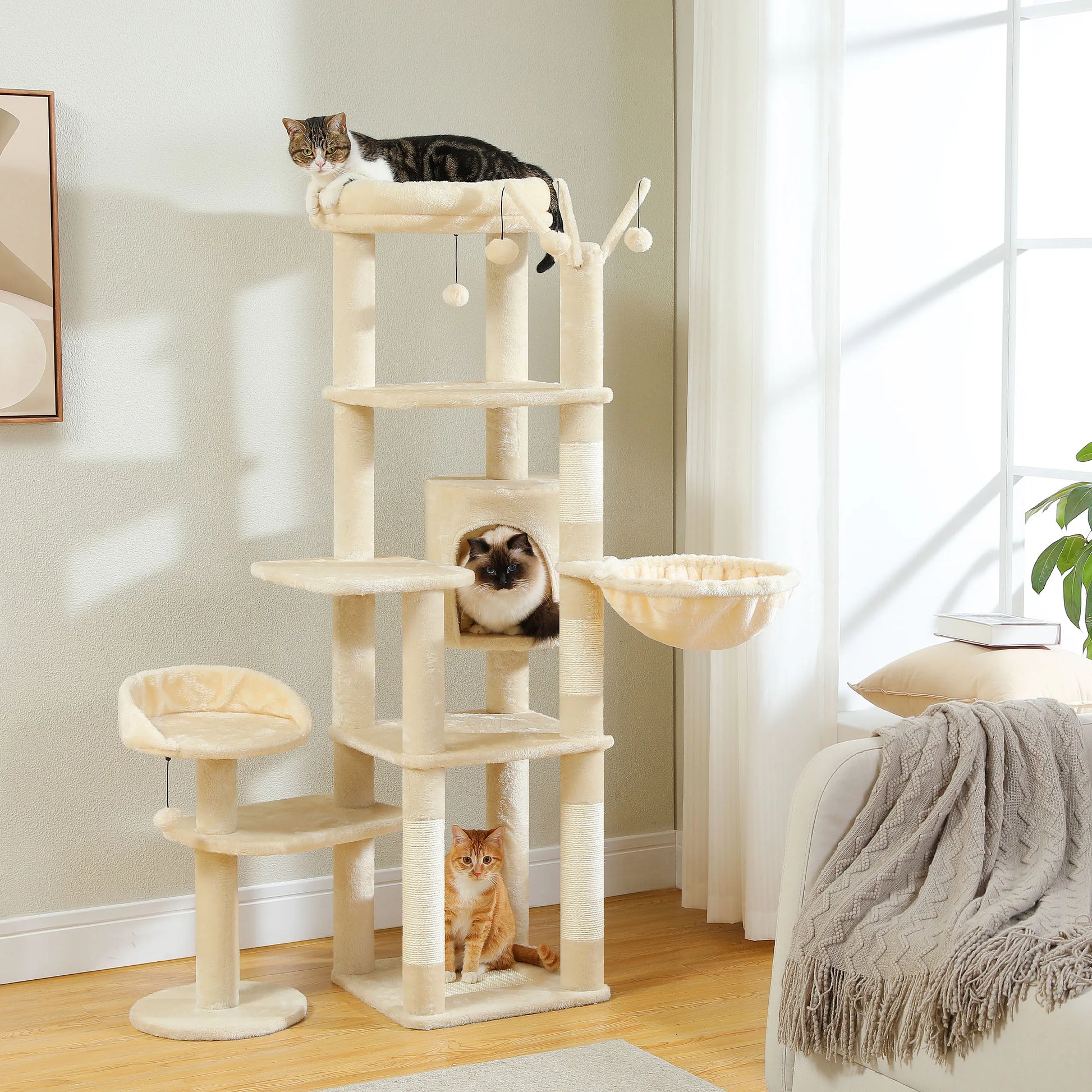 Cat tree with multiple cats on different levels in a home setting