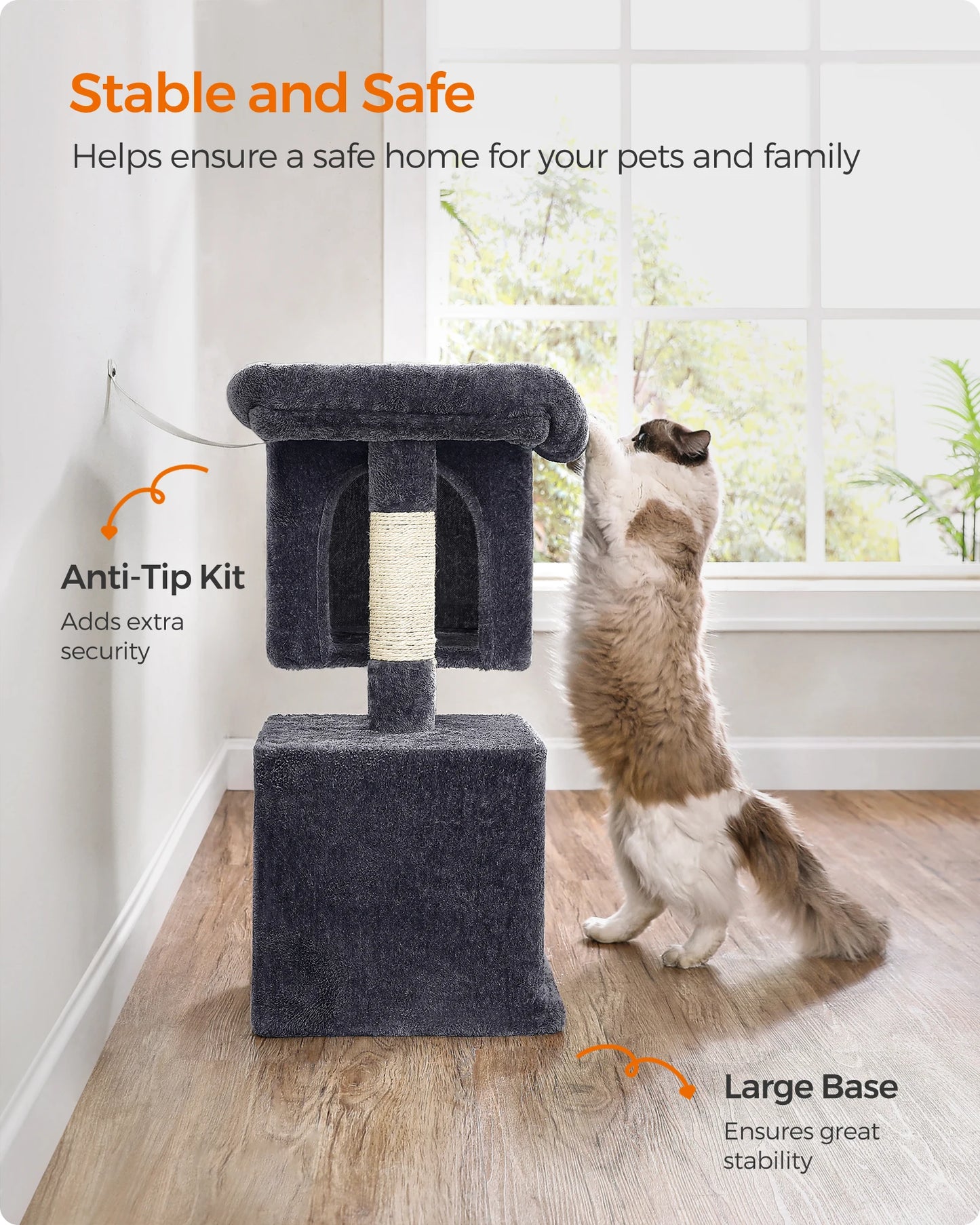 Cat tree with anti-tip kit and large base, cat climbing on it, in a room with a window.