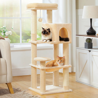 Cat tree with two cats in a room with a window and furniture.